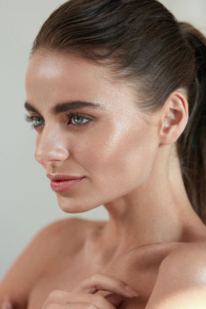 Profile of a woman with glowing skin.