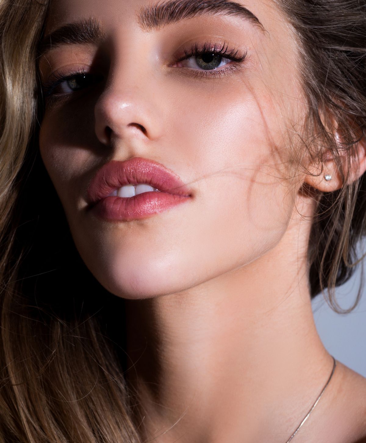 Close-up of a woman's face with soft features.