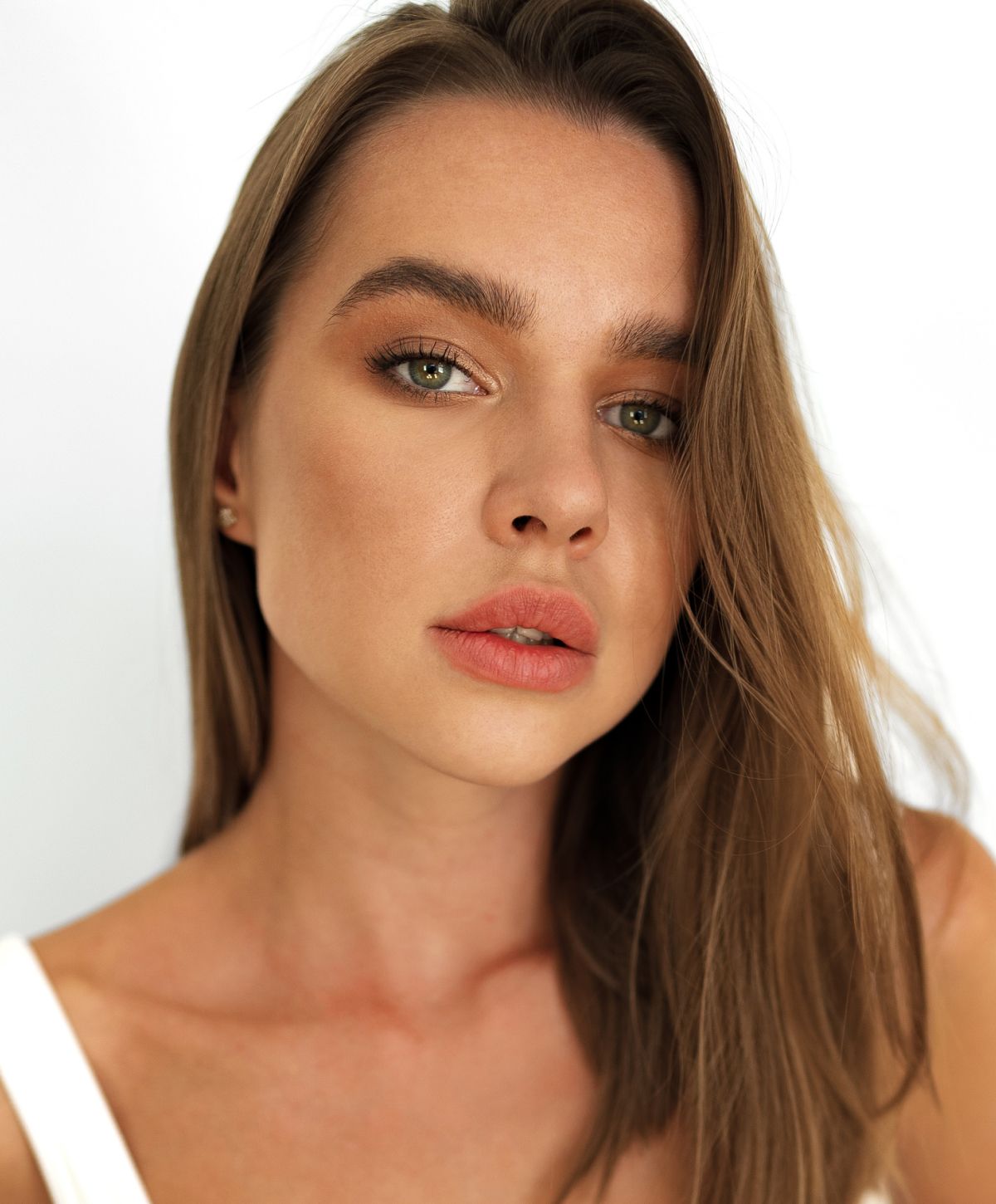 Close-up portrait of a woman with long hair.
