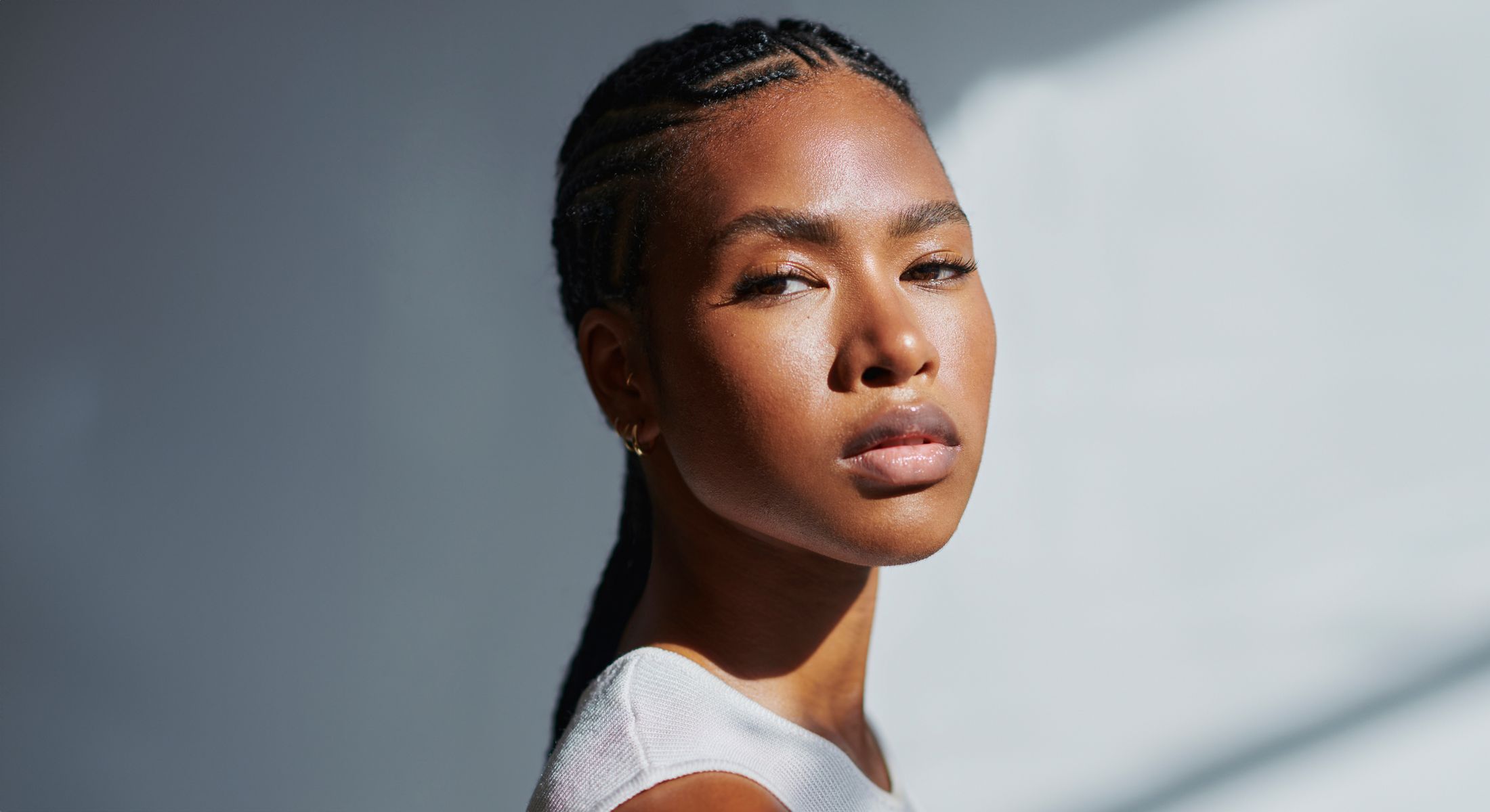 Portrait of a woman with braided hair.